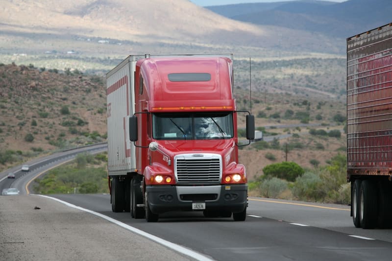 A commercial truck on a highway, typical of the I-49 freight corridor