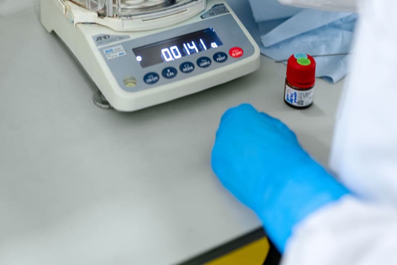 A lab technician reviewing samples, typical of Lenexa’s bioscience employers