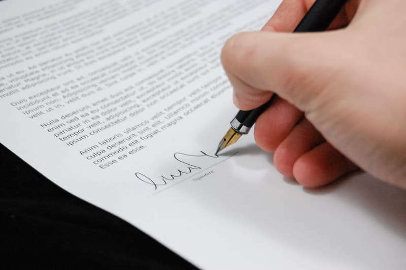 A passport and official documents prepared for a visa application