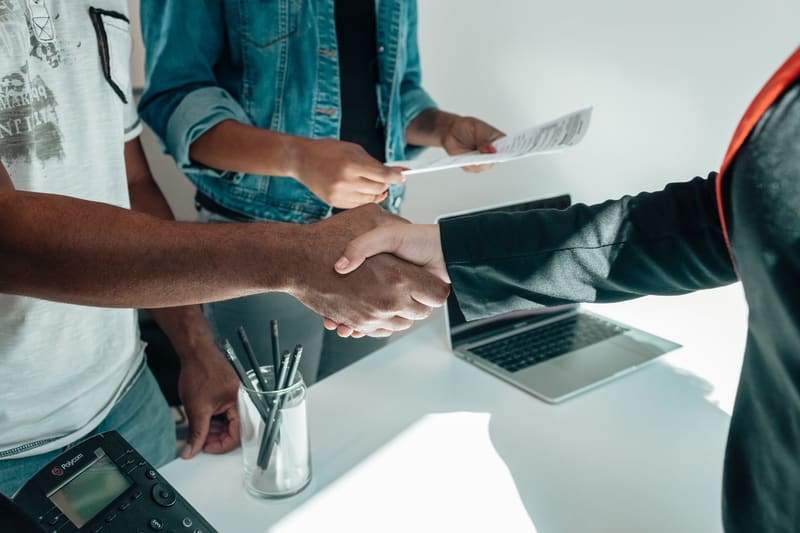 A client discussing fingerprint requirements across a desk